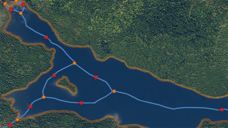 Vue satellite d'une rivière avec des marqueurs triangulaires rouges et des points orange placés à différents endroits